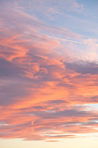 Vibrant Pink and Orange Sunset Clouds in Blue Sky