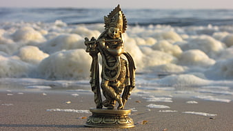 Brass Krishna Statue Playing Flute on Sandy Beach