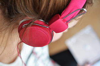 Close-up of Woman Wearing Pink Headphones