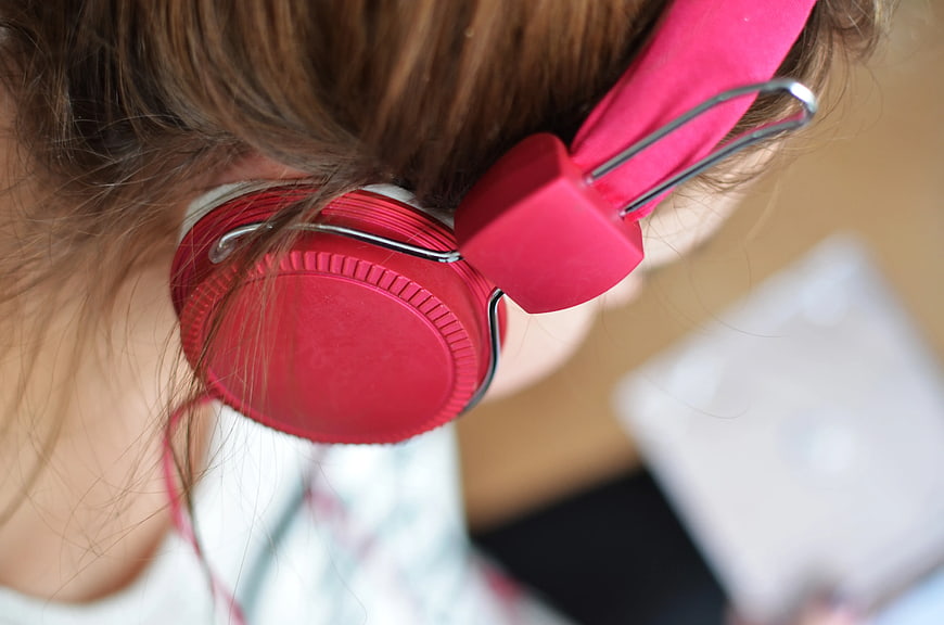 Close-up of Woman Wearing Pink Headphones