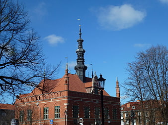 Historic Red Brick Building with Spire in Gdansk, Poland