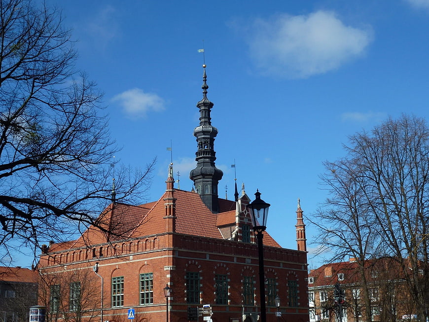 Historic Red Brick Building with Spire in Gdansk, Poland