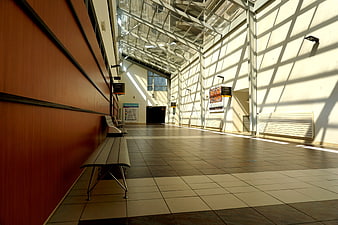 Modern Hospital Corridor With Sunlight And Architectural Shadows