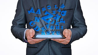 Businessman holding tablet with floating blue alphabet letters