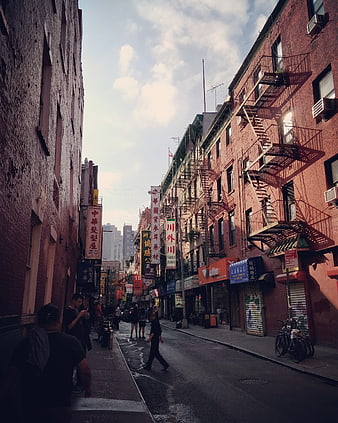 Narrow Chinatown Street in New York City with Fire Escapes