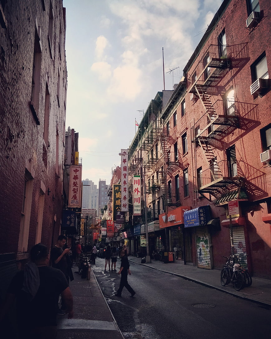 Narrow Chinatown Street in New York City with Fire Escapes
