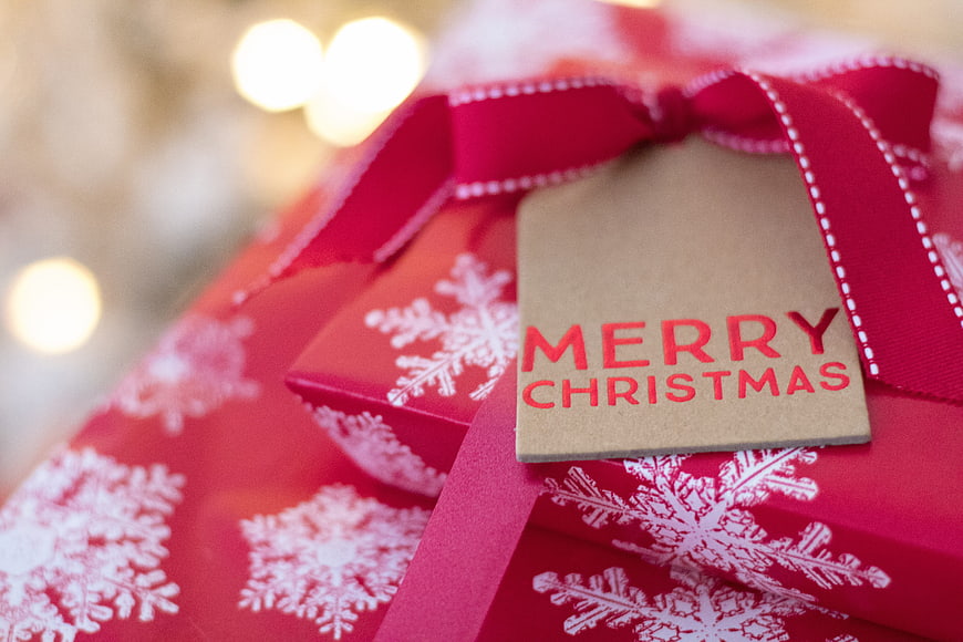 Red Christmas Gift Box with Snowflakes and Merry Christmas Tag