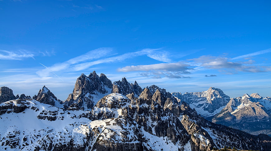 Majestic Snow-Capped Mountain Peaks Under Blue Sky