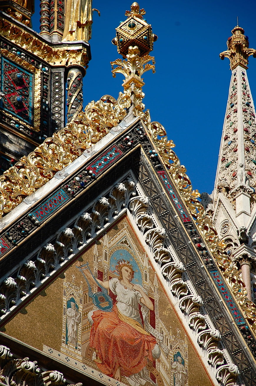 Ornate golden spire and mosaic detail of St Mark's Basilica Venice