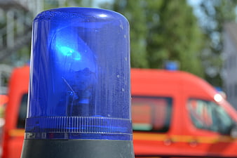 Close-up of blue emergency light on red ambulance