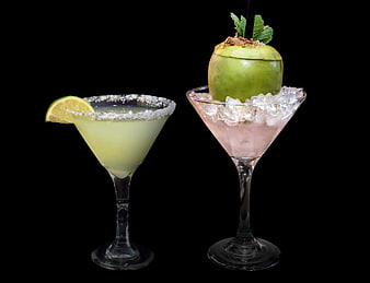 Two Elegant Cocktails With Apple And Lime Garnish On Black Background