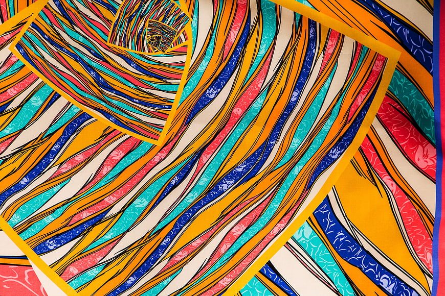 Vibrant Abstract Textile Pattern with Swirling Colors