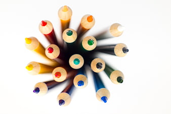 Top View of Colorful Pencils Arranged in a Circle on White
