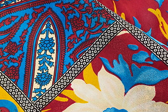 Vibrant Blue and Red Paisley Textile Pattern Close-Up