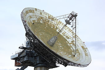 Large Soviet Radio Telescope Dish Antenna Against Overcast Sky