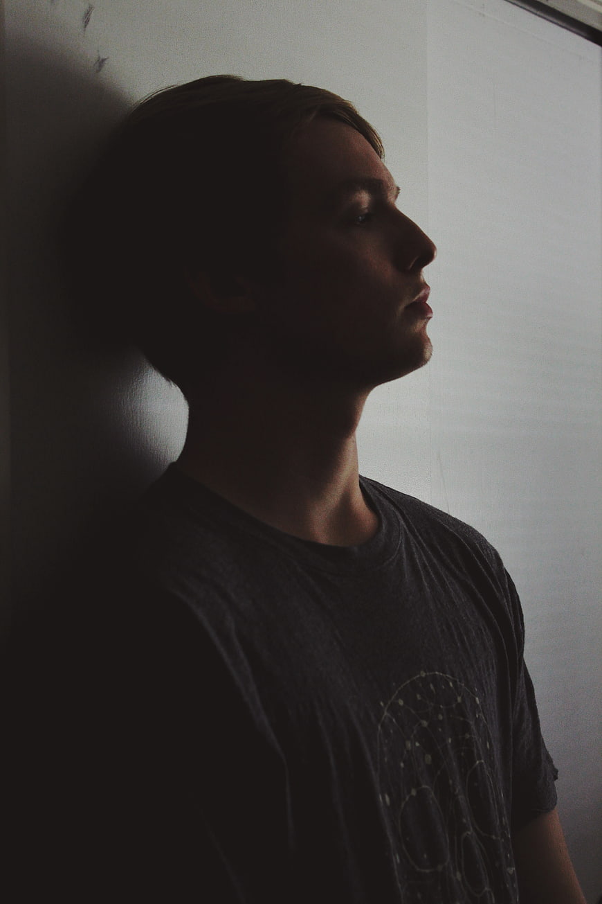 Moody Profile of Young Man in Shadow