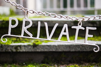 White Private Sign Hanging on Chain