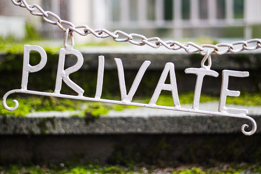 White Private Sign Hanging on Chain