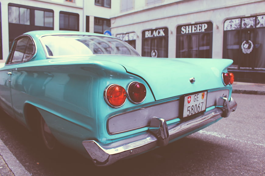 Rear View of Vintage Turquoise Classic Car on Street