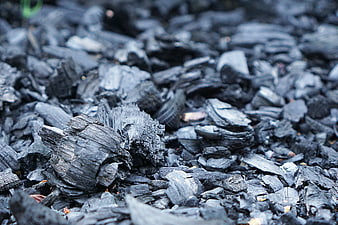 Close-up of Charcoal Pieces and Burnt Wood Texture