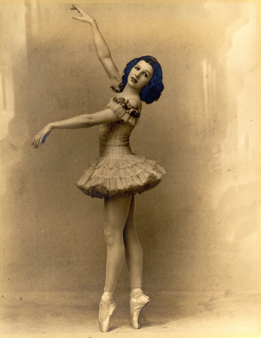 Vintage Hand-Tinted Portrait of a Ballerina in a Classical Ballet Pose