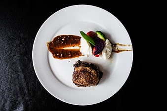Gourmet Steak and Foie Gras with Sauce on White Plate