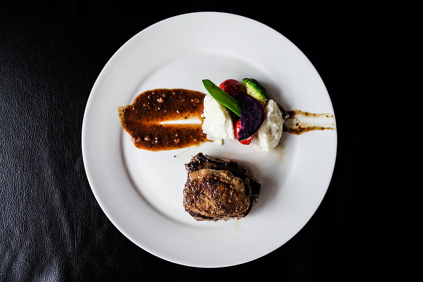 Gourmet Steak and Foie Gras with Sauce on White Plate
