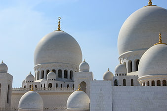 White Domes of Sheikh Zayed Grand Mosque in Abu Dhabi