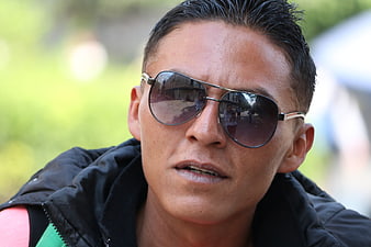 Close-up portrait of man wearing sunglasses outdoors