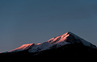 Snowy Mountain Peak with Pink Alpenglow at Dusk