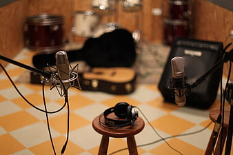 Professional Recording Studio Setup With Microphones And Guitar