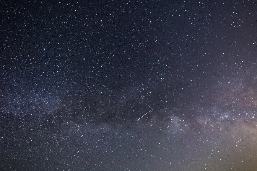 Milky Way Galaxy with Shooting Stars in Night Sky