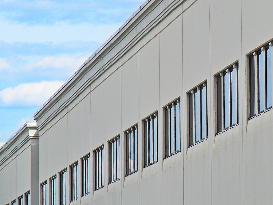 Modern industrial building facade with repeating windows