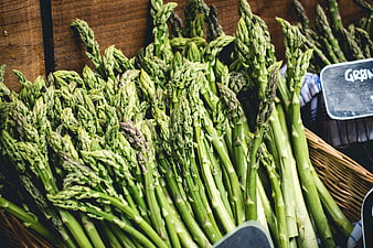 Fresh green asparagus spears in a wooden market basket