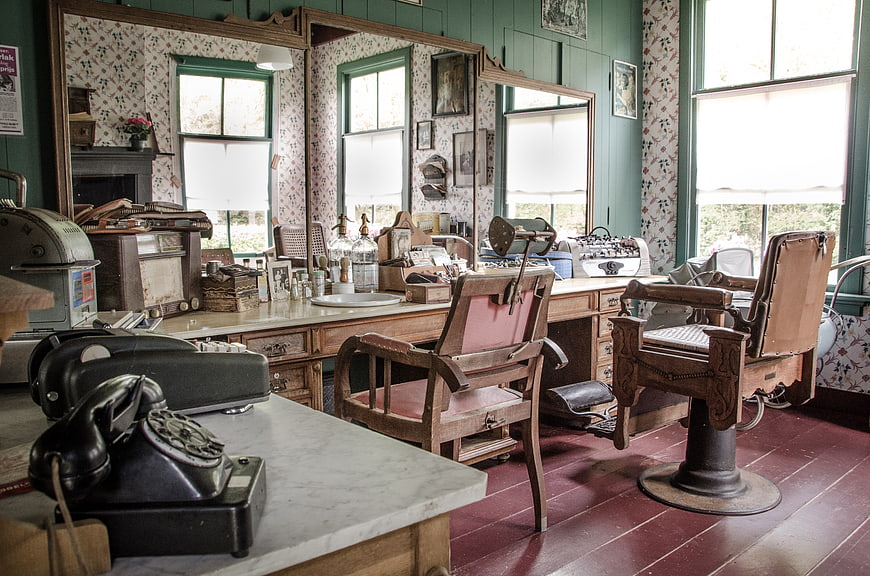 Vintage Barbershop Interior with Antique Chairs and Tools