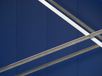 Abstract Blue Corrugated Metal Wall with Diagonal Beams