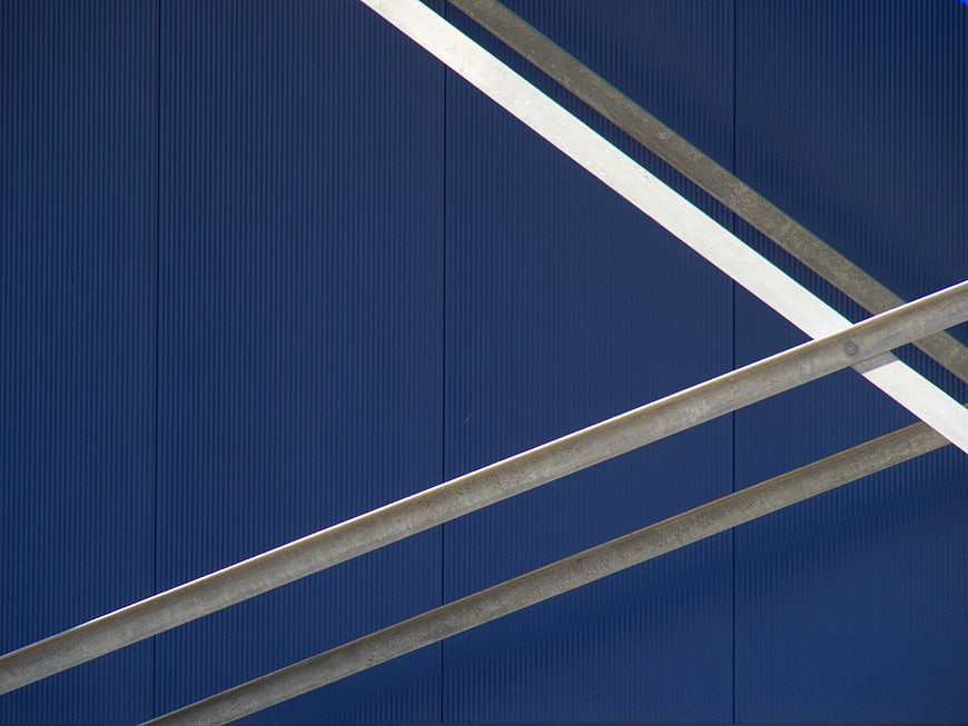 Abstract Blue Corrugated Metal Wall with Diagonal Beams