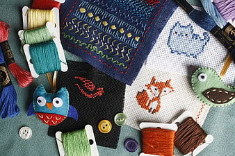 Colorful Embroidery Stitches, Felt Animals, and Sewing Threads Flat Lay