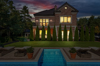 Luxury Brick House with Pool at Dusk