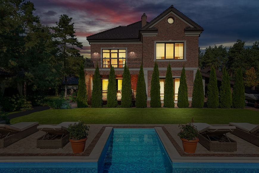 Luxury Brick House with Pool at Dusk
