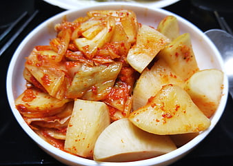 Bowl of spicy kimchi and radish side dish