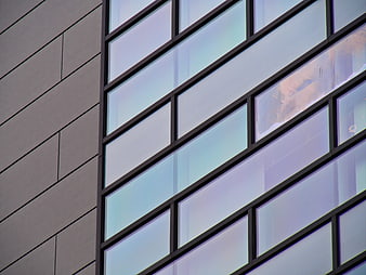 Modern Building Facade with Geometric Glass Windows