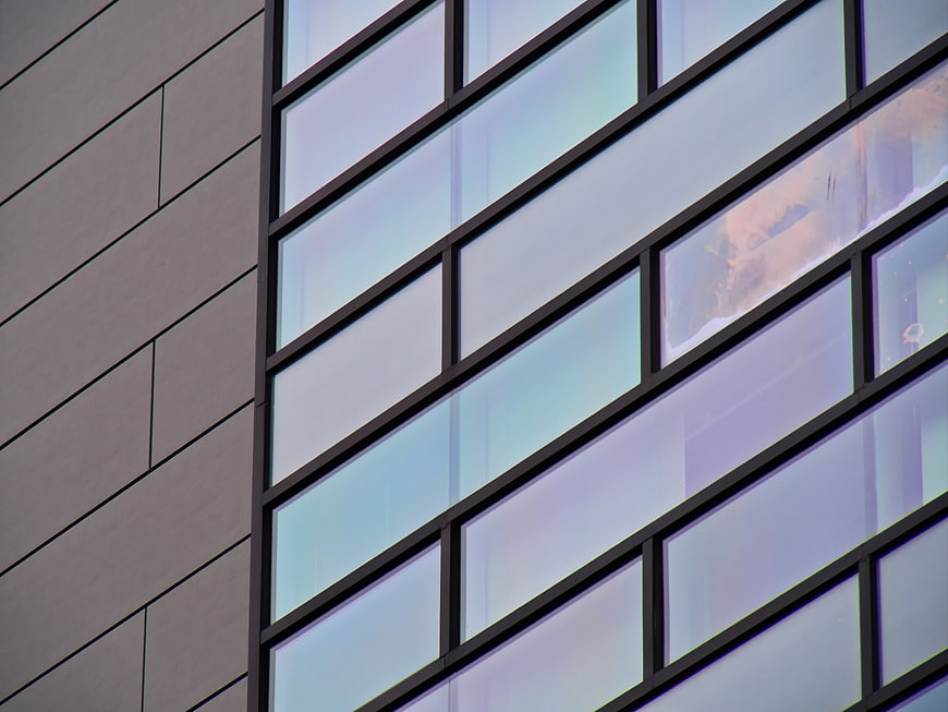 Modern Building Facade with Geometric Glass Windows