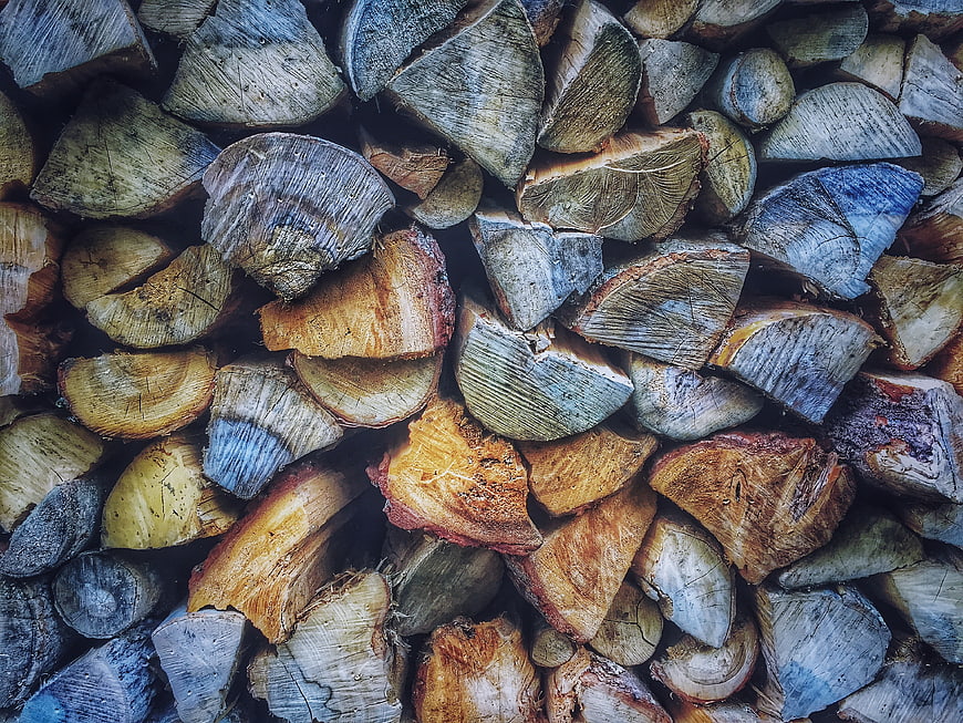 Stacked Firewood Logs Texture Background