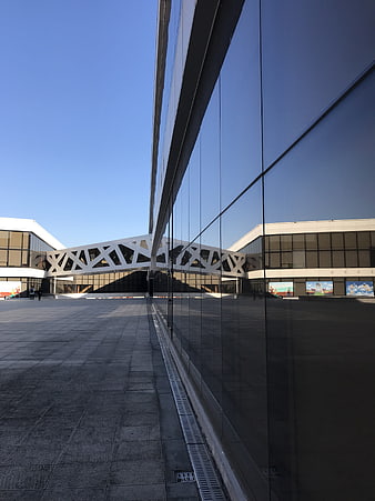 Modern glass building facade reflecting urban architecture