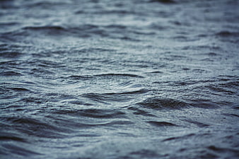 Close-up of rippling grey water surface texture