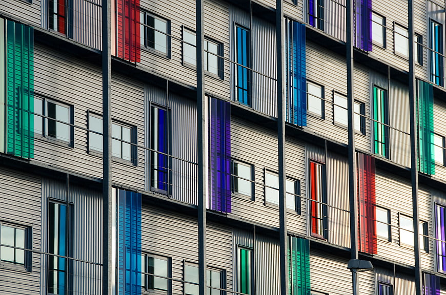 Modern Apartment Facade with Colorful Vertical Accents