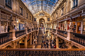 Grand Passage Commercial Arcade Interior With Glass Roof And Shoppers