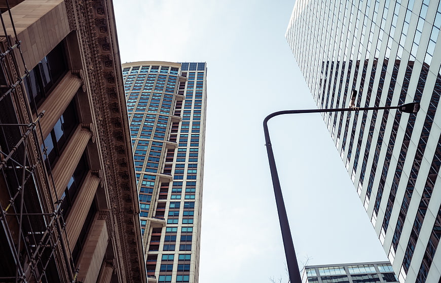 Low angle view of modern and classical city skyscrapers