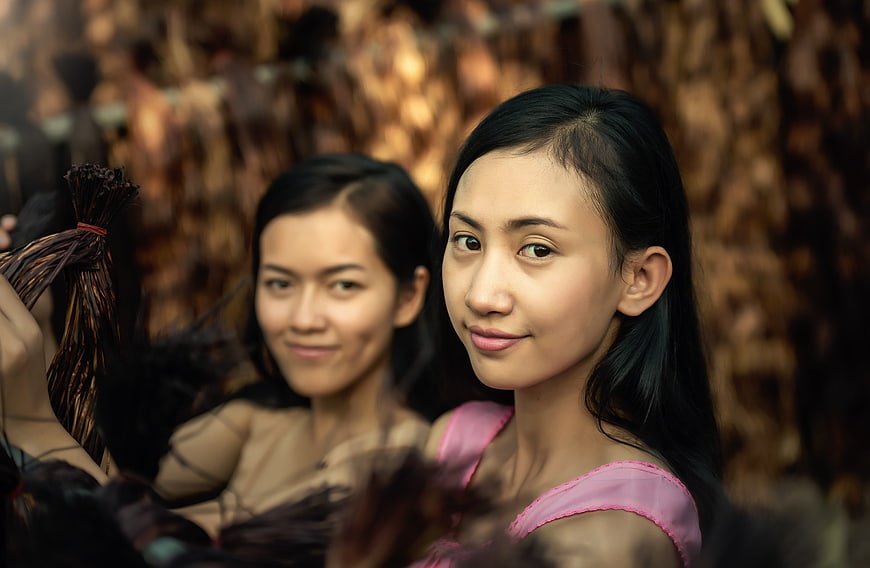 Portrait of Two Asian Women in Traditional Dance Costumes